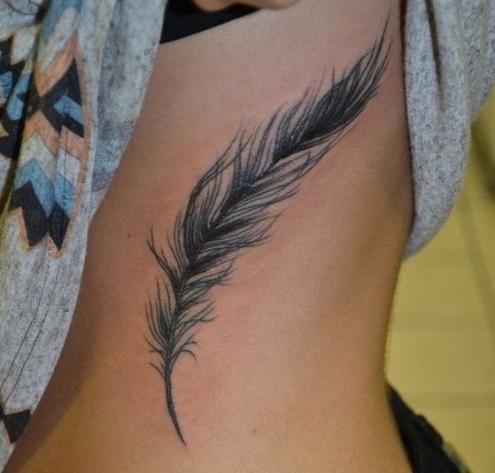 pluma real tatuaje